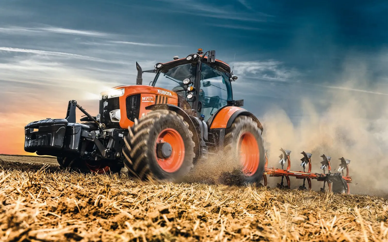 A Kubota M7 tractor ploughing a field