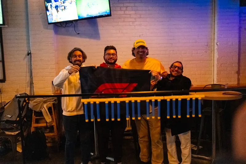 Fans holding up the flag at the bar rail on Sao Paulo Grand Prix race day