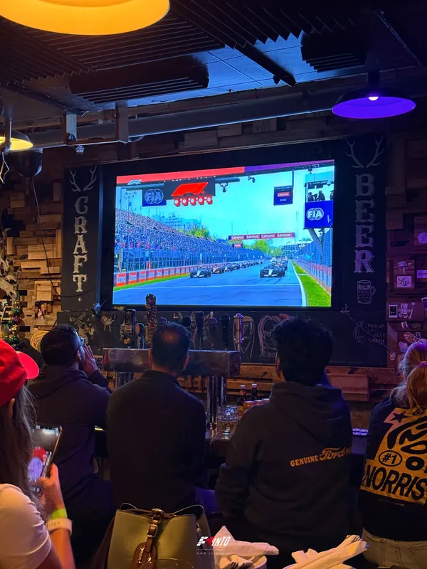 Lights out on the big screen and an F1inTO race day room watching the Canadian Grand Prix start