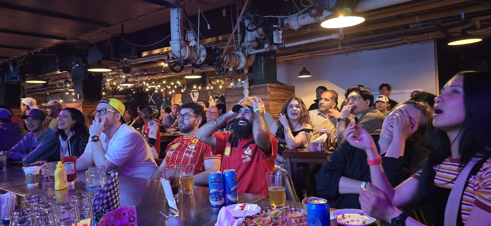 A packed F1inTO room holding its breath during the Canadian Grand Prix