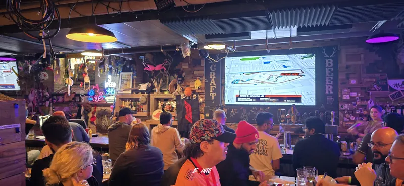 An F1inTO race day room under the big screen, live timing up for the Miami Grand Prix
