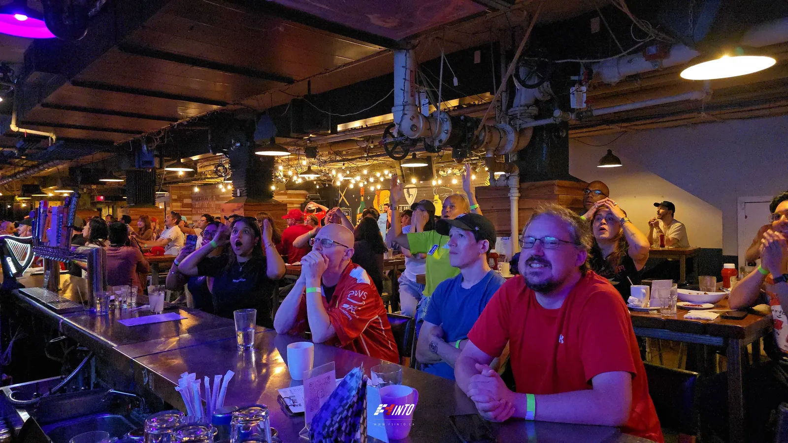 Fans along the bar locked on the screen as the Monaco Grand Prix gets under way at an F1inTO race day