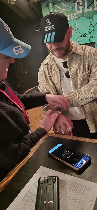 A wristband going on at the door on Monaco Grand Prix race day