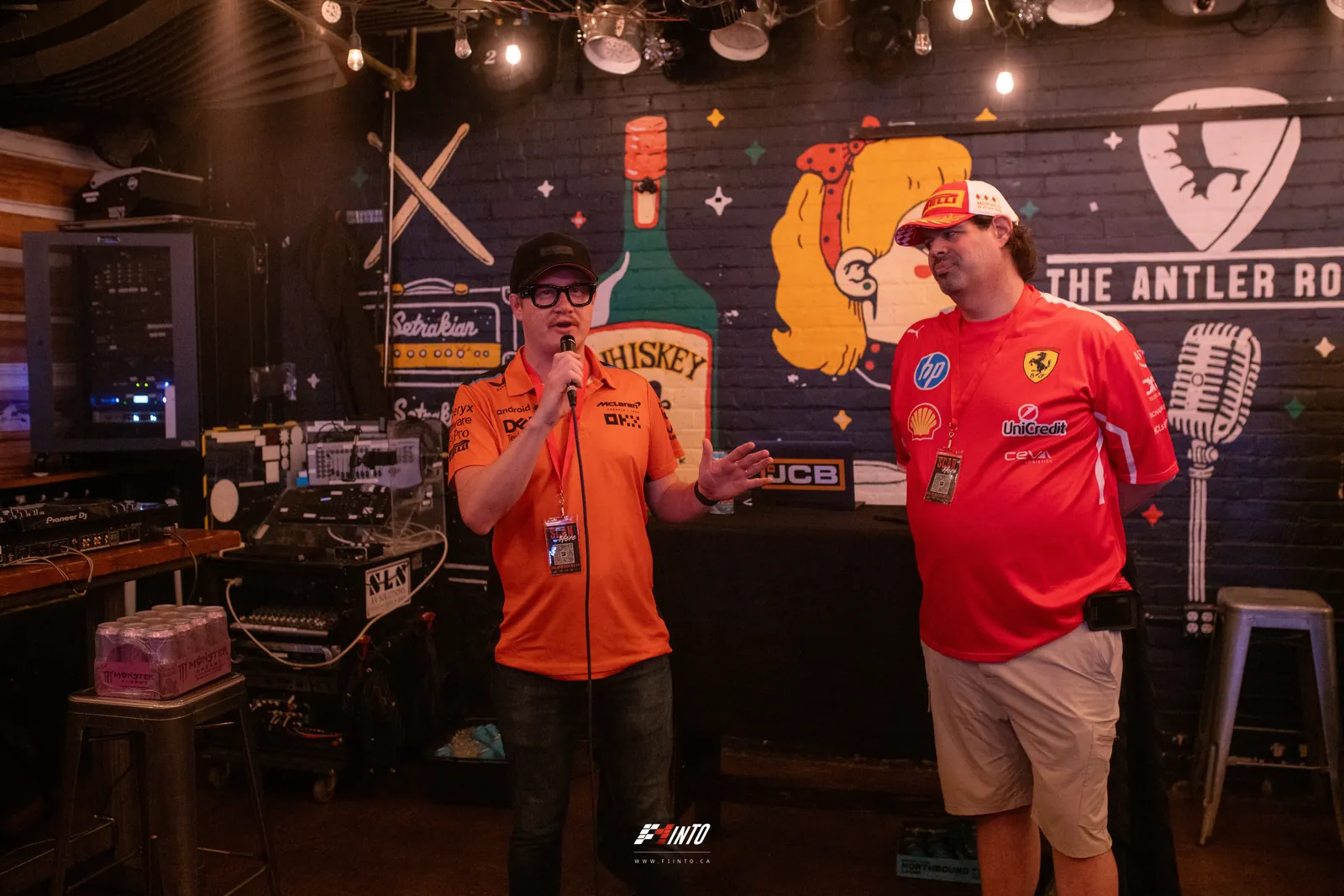 The F1inTO hosts on the mic running the prize draw at the front of the room on Monaco Grand Prix race day
