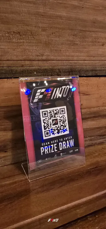 The scan-to-enter F1inTO prize draw card on a table on Canadian Grand Prix race day