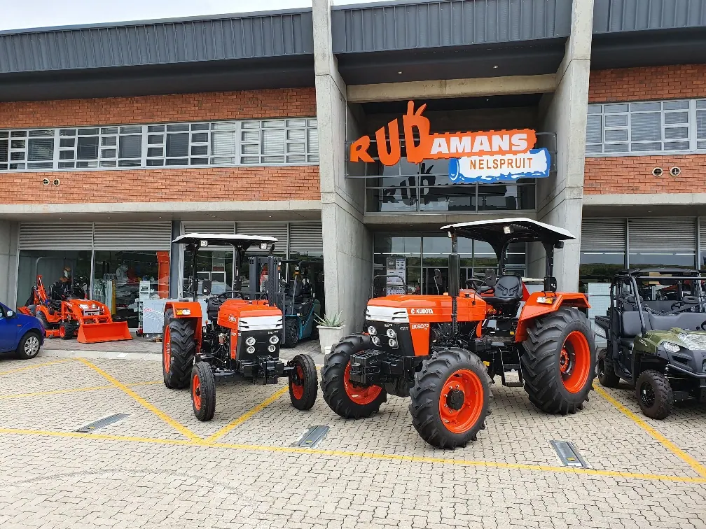 E-Kubota tractors lined up outside a Kubota dealership