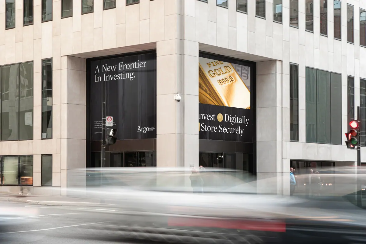 Argo billboard reading A New Frontier In Investing on a downtown stone building