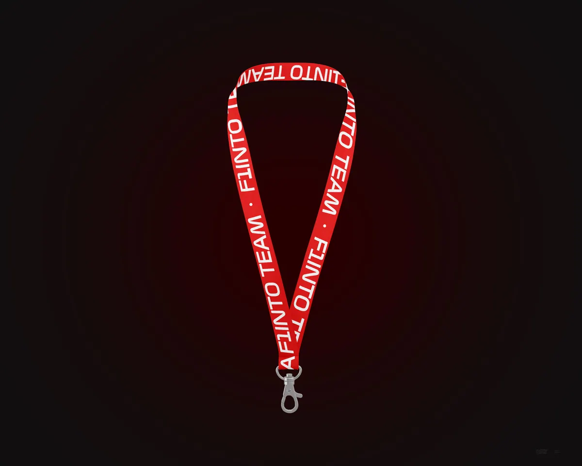 Red F1inTO team lanyard on a dark background