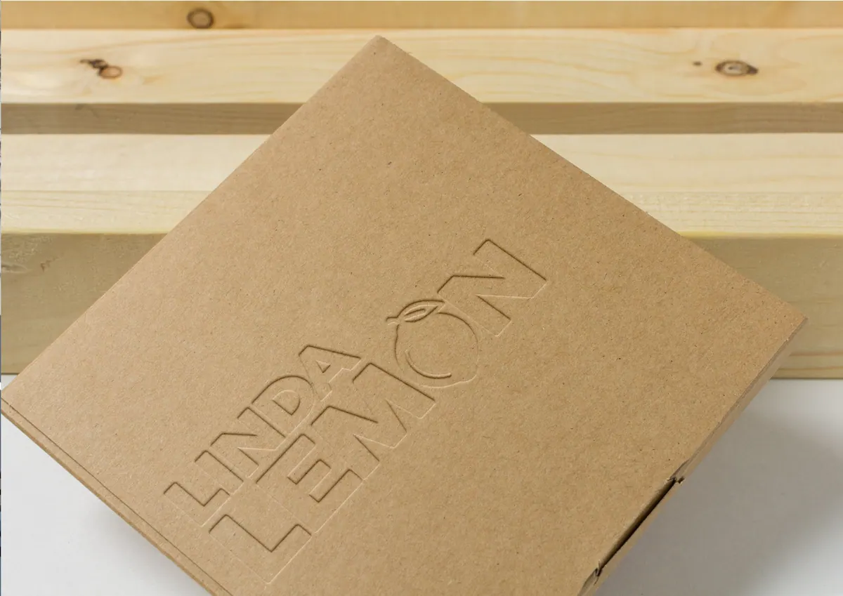 Linda Lemon logo debossed into a kraft box