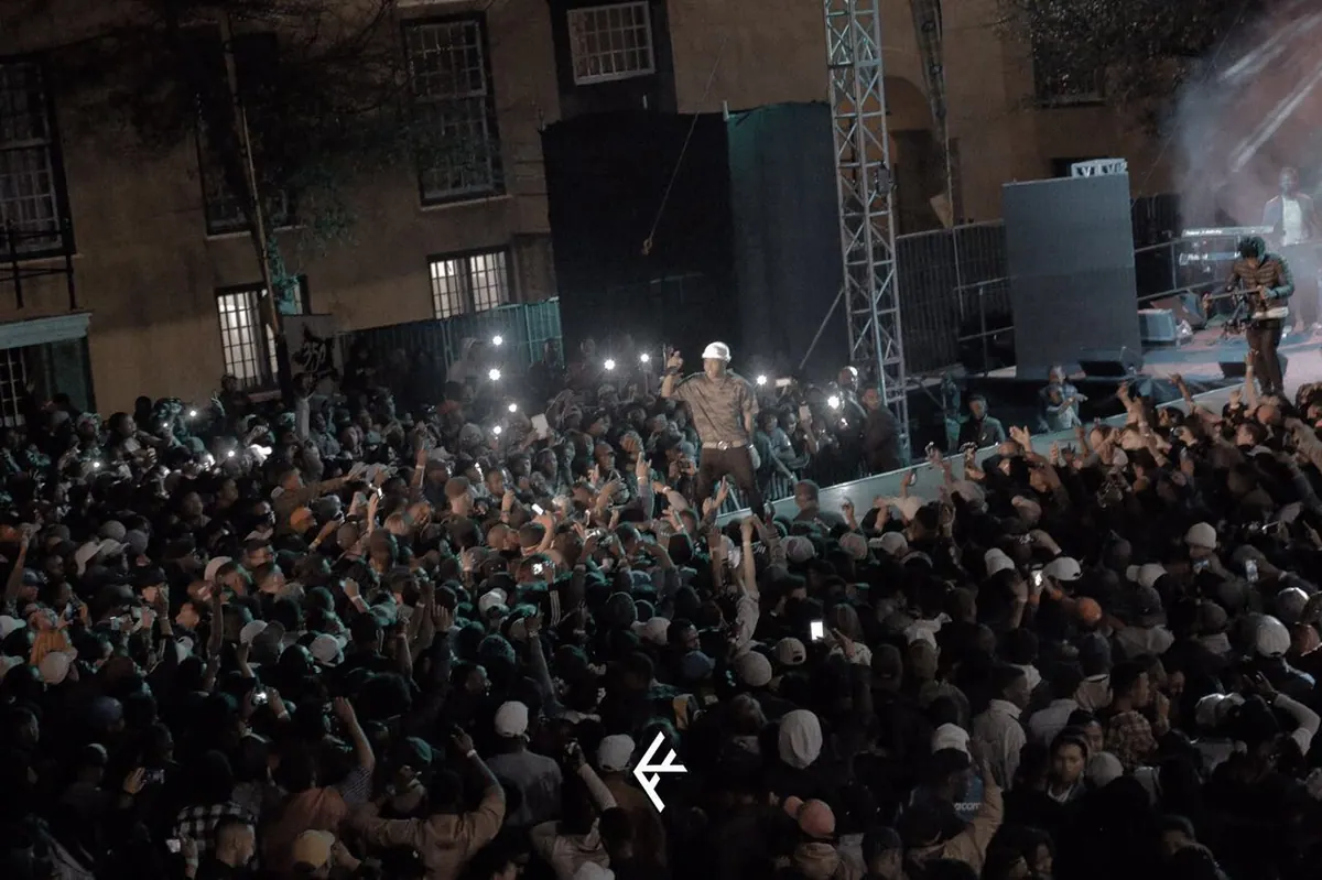 Night crowd with phone lights raised at a Nasty C show