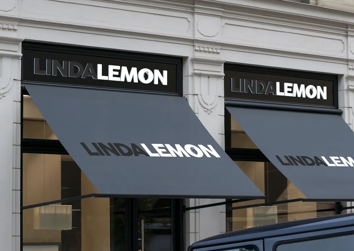 Storefront awnings branded with the Linda Lemon logo