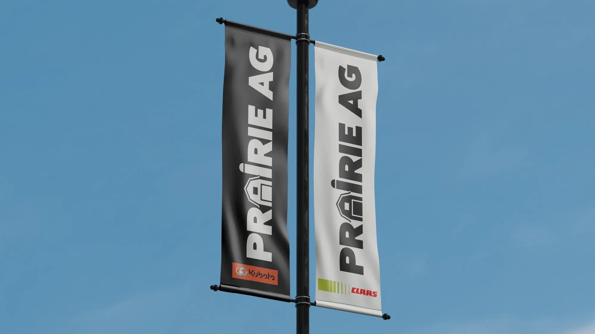 Prairie Ag street banners on a lamp post against a blue sky