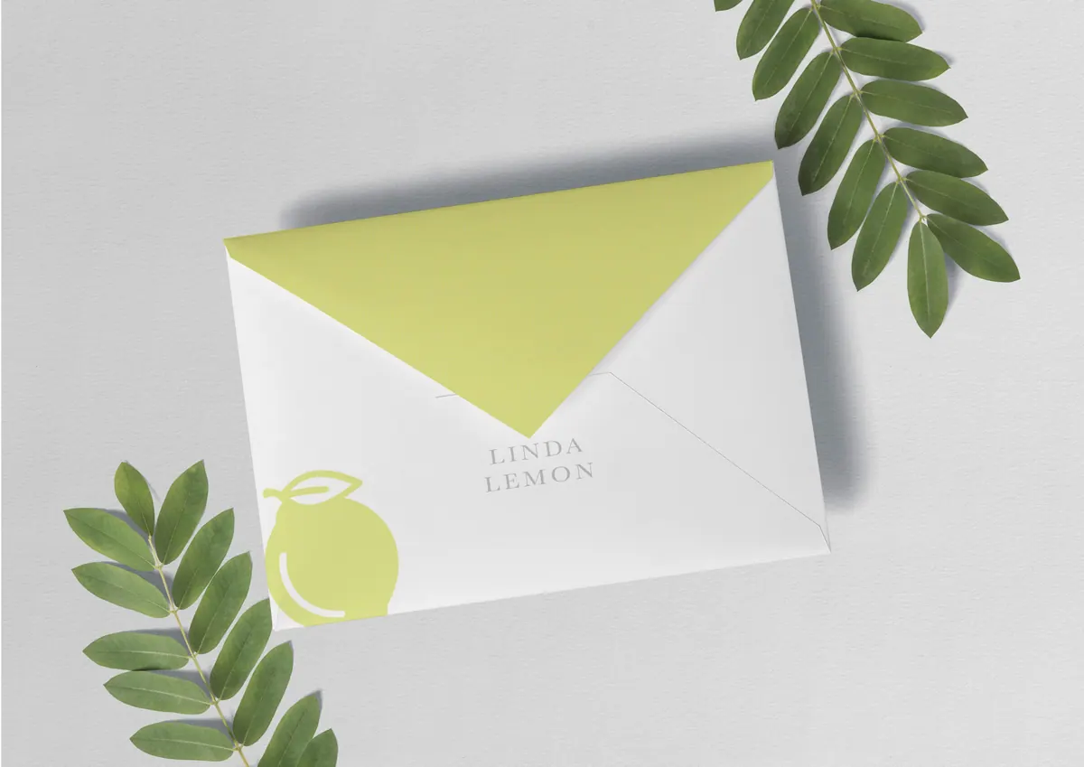 Linda Lemon envelope with a lime liner and green leaves