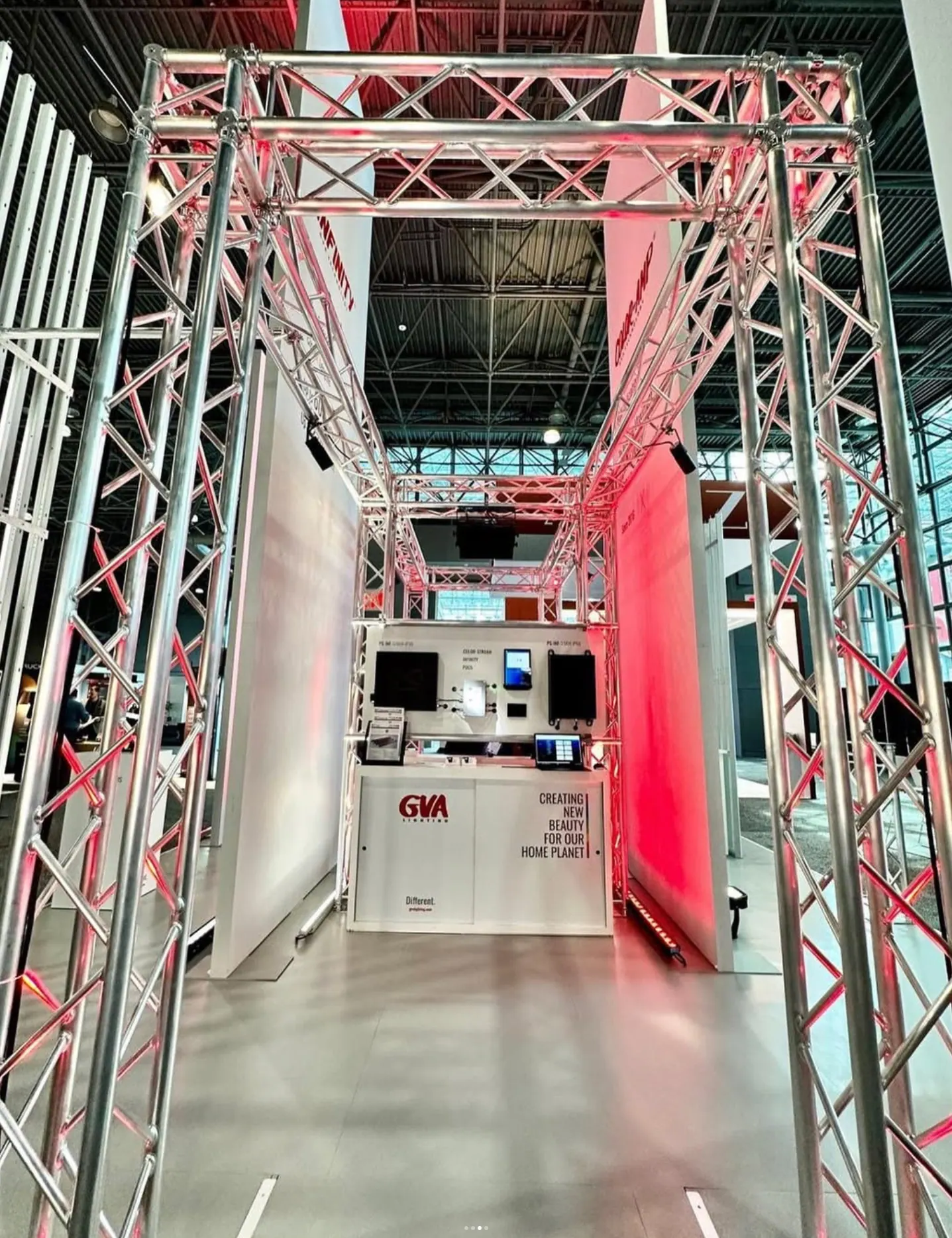 Truss tunnel entrance to the GVA Lighting stand washed in red and white light