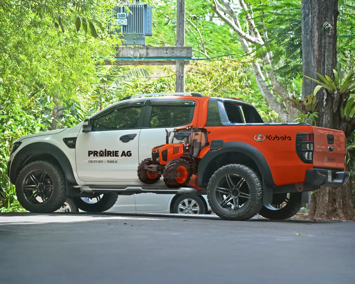 Pickup truck with orange and white Prairie Ag vehicle wrap