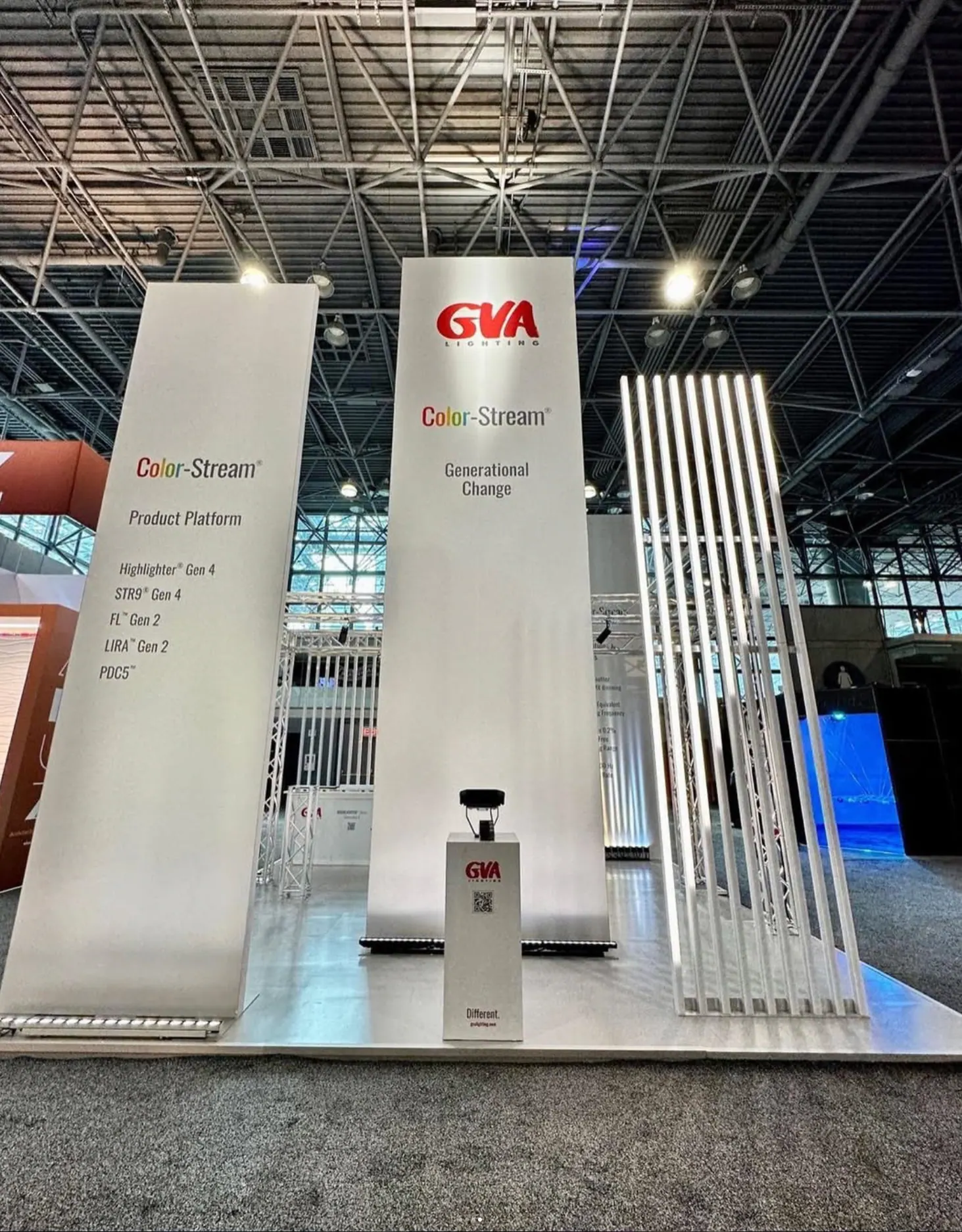 GVA Lighting trade show stand with white product towers and linear light fixtures