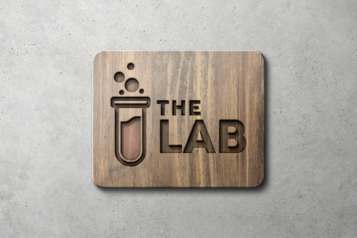 The Lab logo routed into a wooden plaque