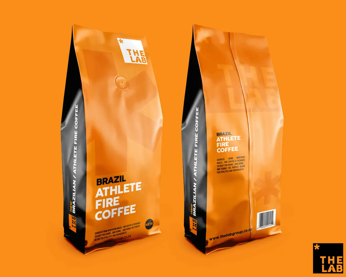 Two orange The Lab coffee bags on an orange background