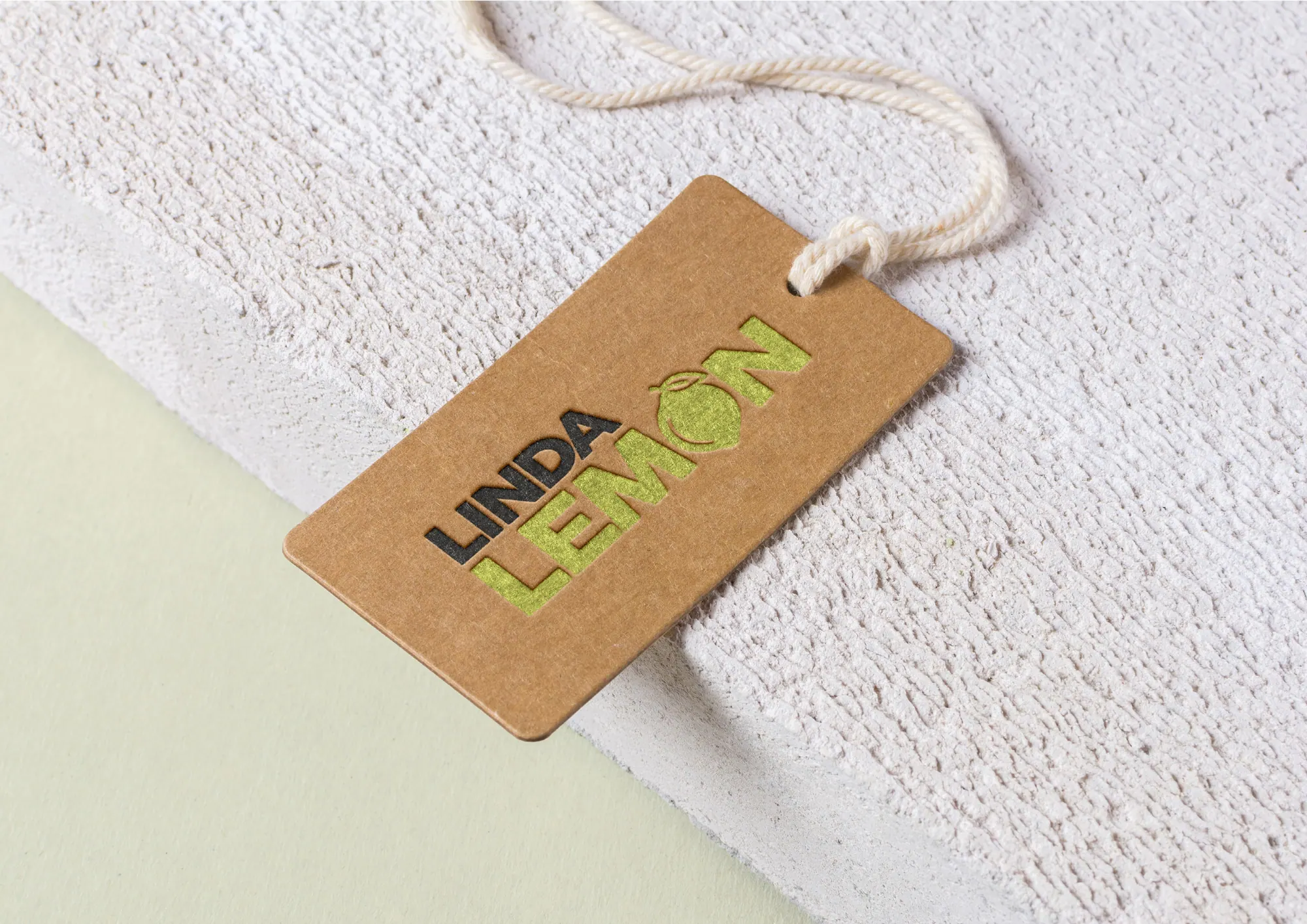 Kraft swing tag printed with the Linda Lemon logo