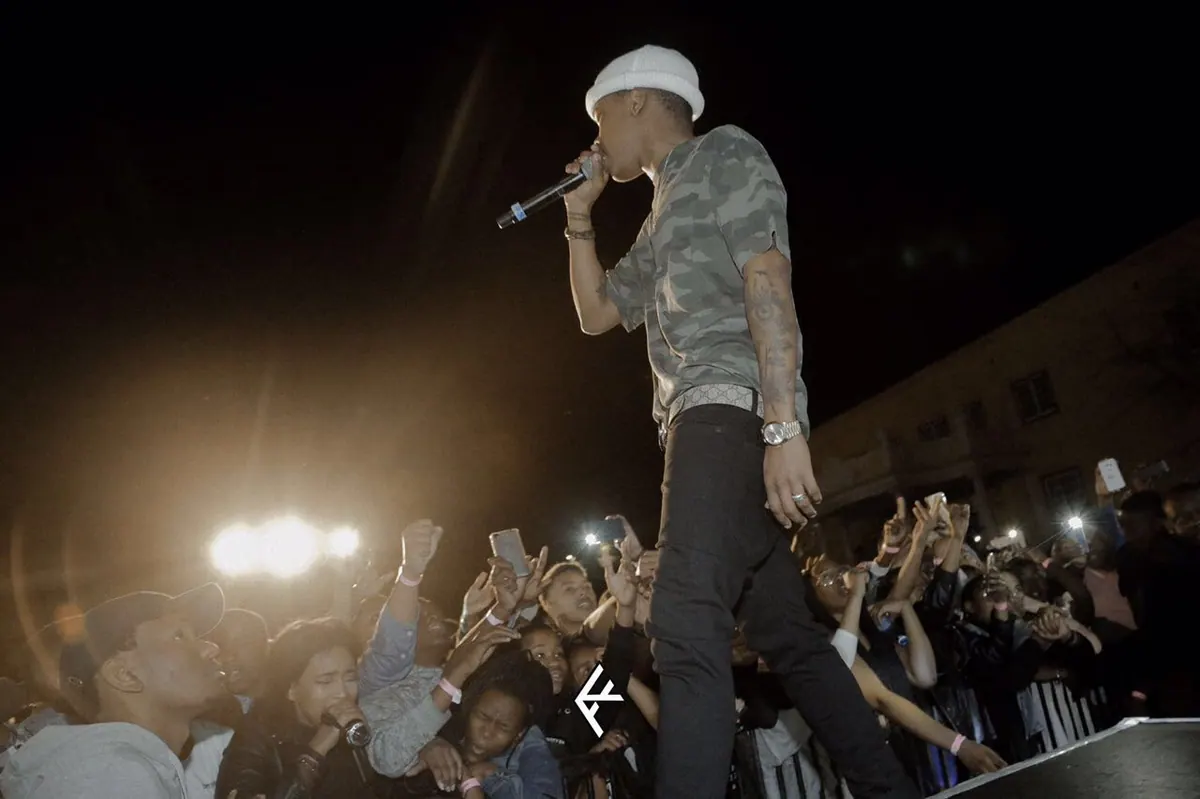 Nasty C performing above the crowd