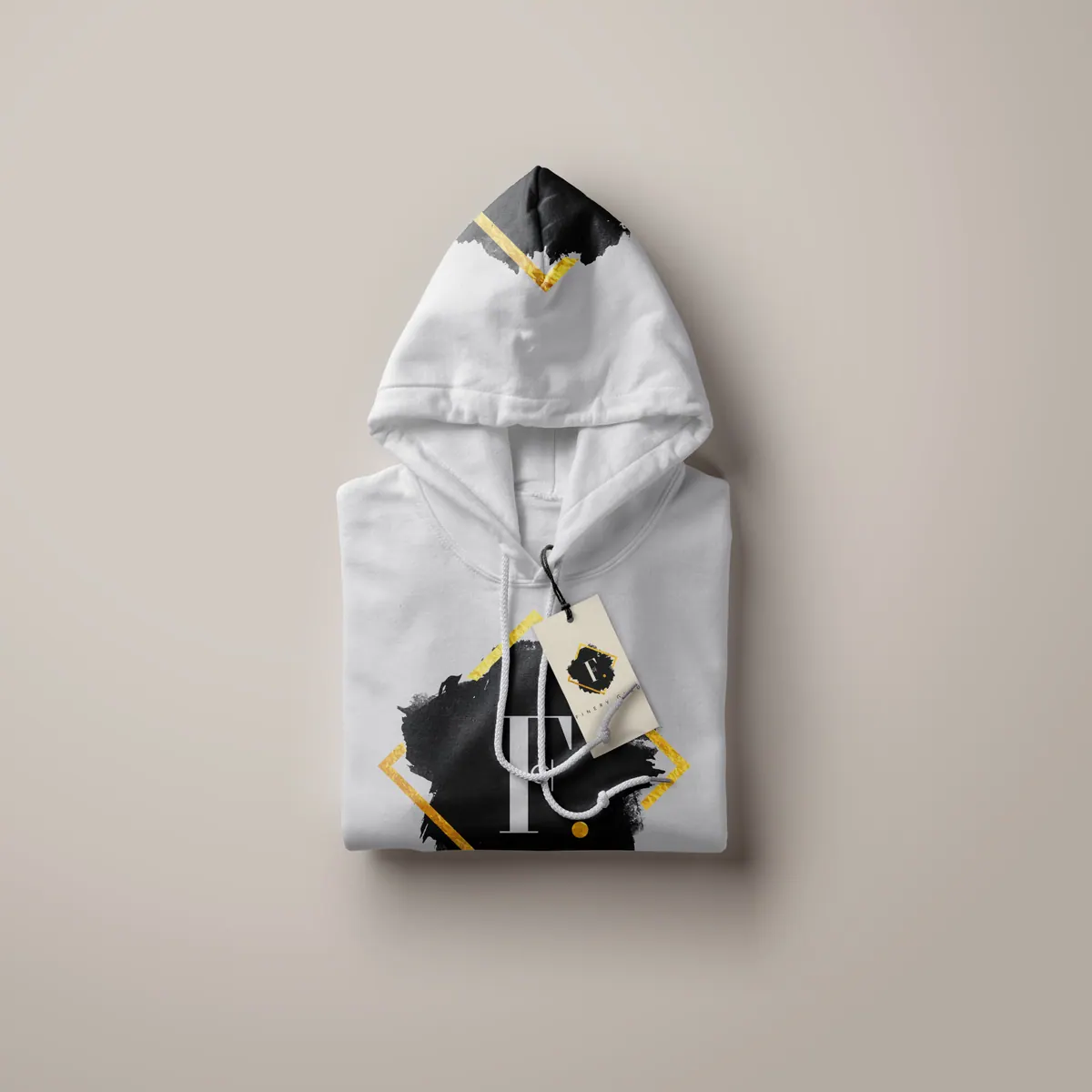 Folded white hoodie printed with the Finery Guru ink-splash mark