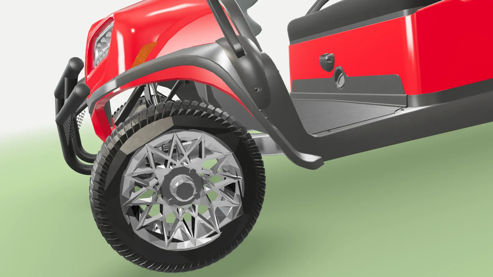 Low beside the Onward’s front wheel, the chrome rim and tyre close up