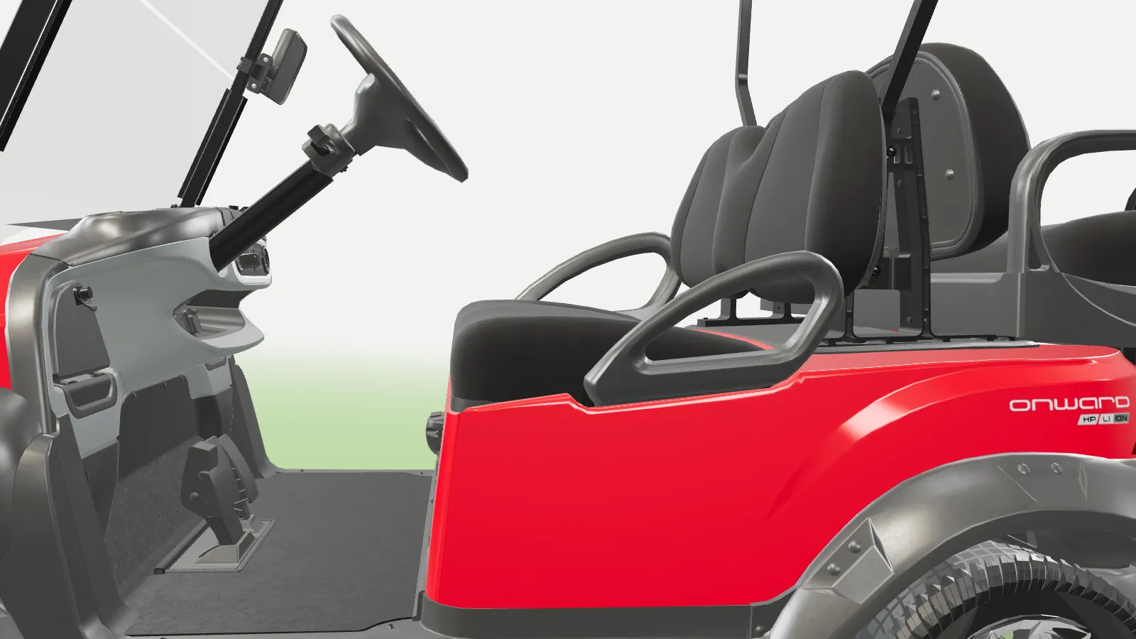 Along the side of the Onward, looking in at the front seats and steering wheel
